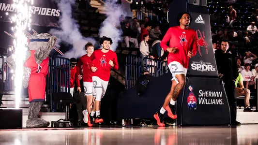 George Washington III runs out of the tunnel prior to a men's basketball game