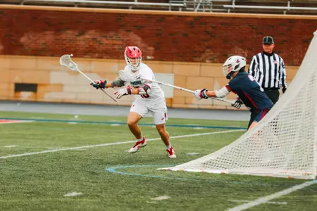 Jack Ricciardi carries the ball through X during Richmond's 17-2 win over Robert Morris on Feb. 8, 2025
