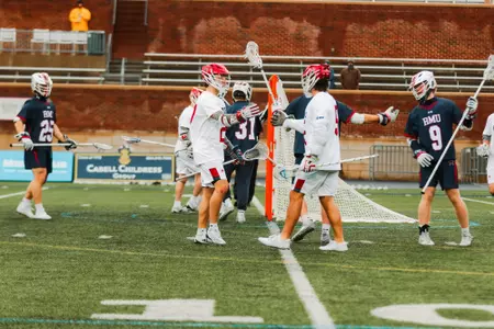 Lucas Littlejohn and Aidan O'Neil embrace following a goal against Robert Morris on Feb. 8, 2025