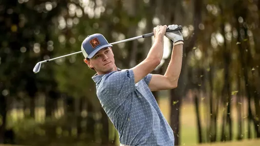 Drew Carlin holds his follow through