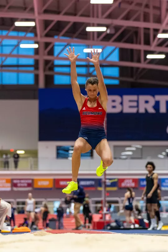 Molly Wise descending towards the pit on a long jump attempt at Liberty