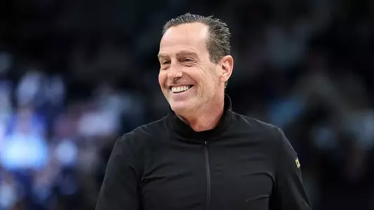 Kenny Atkinson smiles on the sideline