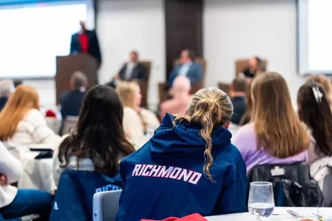 Listening to a speaker at the 2025 Alumni Achievement Awards