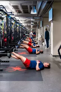 A group of players stretching in a line