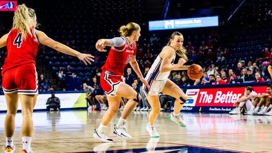 Anna Camden dribbling around Davidson