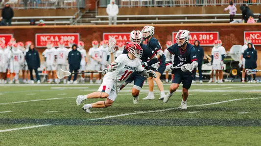 Gavin Creo dodges a defender during Richmond's 17-2 win over Robert Morris on Feb. 8, 2025