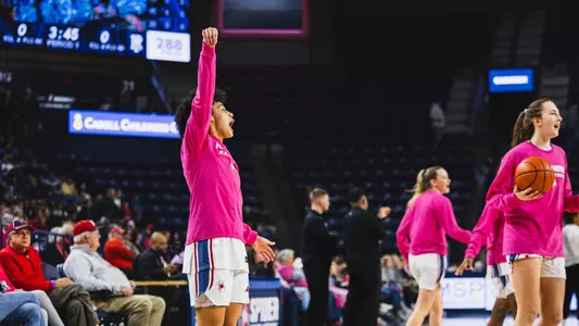 Faith Alston celebrating a three pointer in warmups