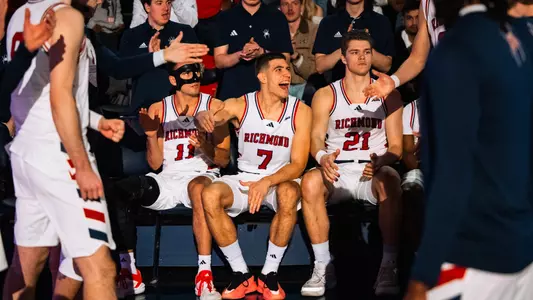 Dusan Neskovic slaps hands with a teammate during starting lineup introductions