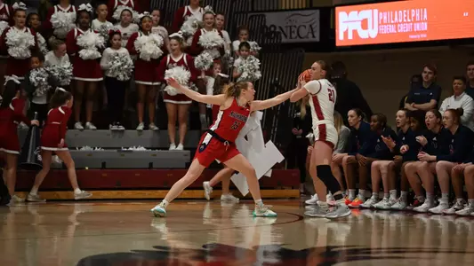 Katie Hill defending a Saint Joseph's player