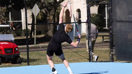 Paxton Pritchard serving the ball against the Citadel