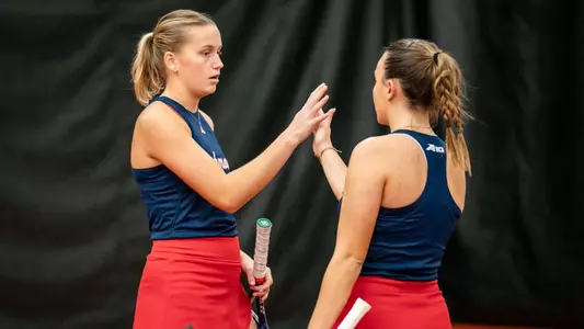Claire Le Du and Lainey O'Neil high fiving
