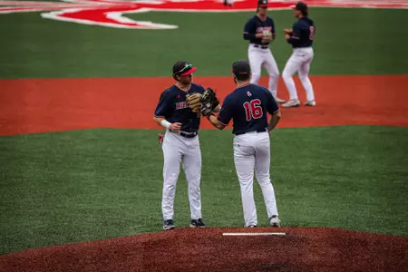 Brady O'Brien gives Esteban Rodriguez a pep talk prior to starting the inning