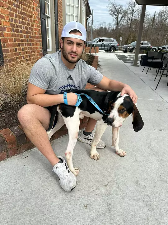 Brian Catanzarite with a dog outside Starbucks