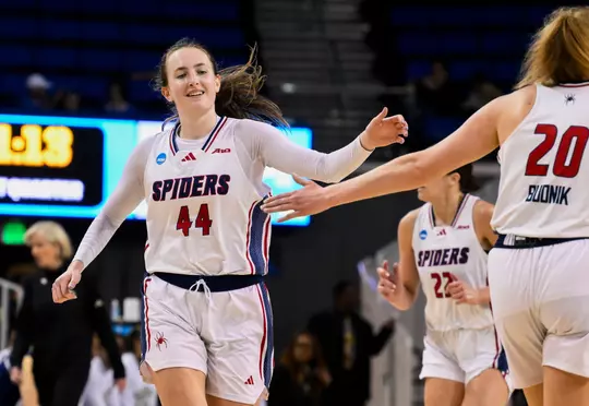 Mar 21, 2025; Los Angeles, California, USA; Richmond Spiders forward Maggie Doogan (44) celebrates with forward Addie Budnik (20) after scoring a basket during the first quarter of an NCAA Tournament first-round game at Pauley Pavilion presented by Wescom. Mandatory Credit: Robert Hanashiro-Imagn Images