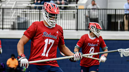 Mitchell Dunham guards a Georgetown attackman during Richmond's 13-12 upset win over the No. 13 Hoyas Saturday, March 22