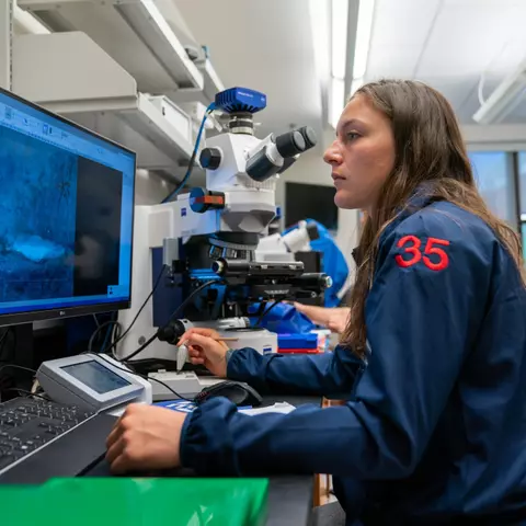 An athlete studies in a lab
