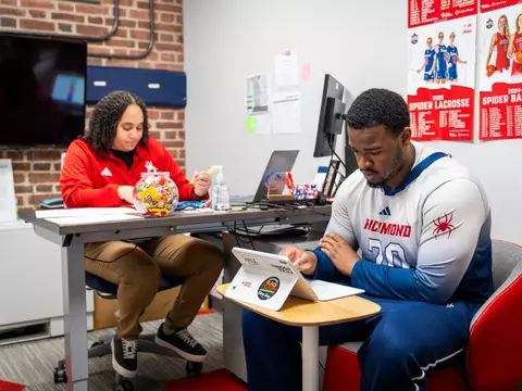 A student studies in the office of an SP4 employee