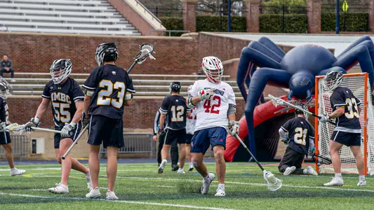 Max Merklinger celebrates a goal during Richmond's 14-8 win over UMBC Saturday, March 8