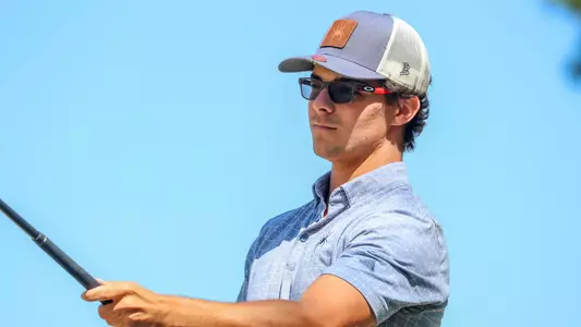 Carson Baez lines up his tee shot