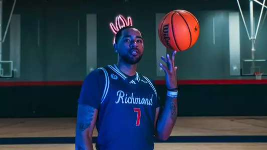 Jaden Daughtry spins a ball on his left finger and stares at the camera