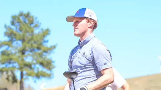 Cole Ekert leans on his driver following a tee shot