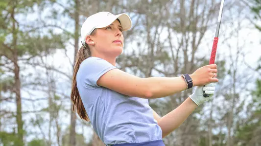 Olivia Wilkie stares at her shot on the range