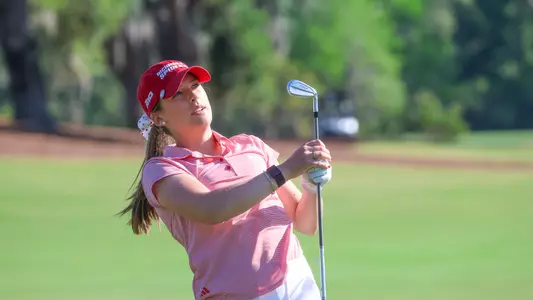 Olivia Wilkie grasps the shaft of her club following a shot