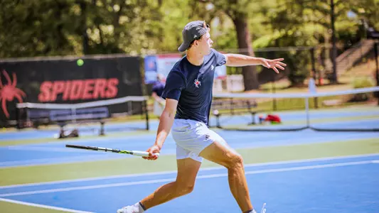 Davus Wiley hitting a tennis ball
