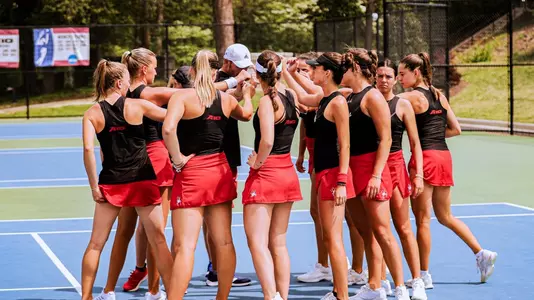 Women's Tennis huddled pre-match
