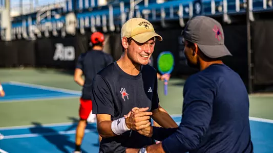 Photo of Dylan Atkinson after winning a singles match