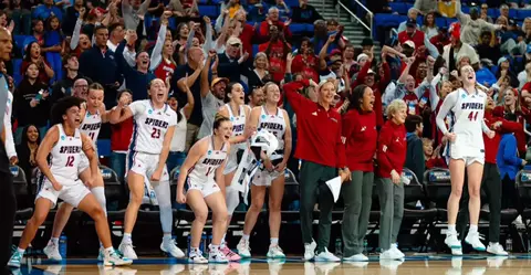 Spiders bench reacts during its NCAA Tournament win vs Georgia Tech