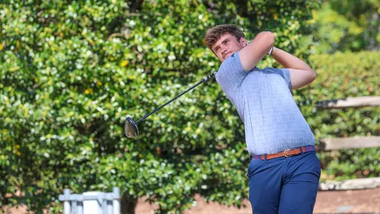 Jack LaPiana holds his follow through after smashing a drive