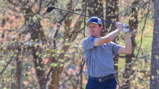 Cole Ekert holds a high follow-through after his tee shot