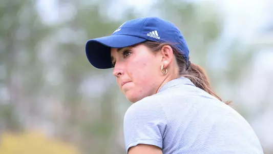 A tight shot of Katie Magner showing the left side of her face as she approaches the ball