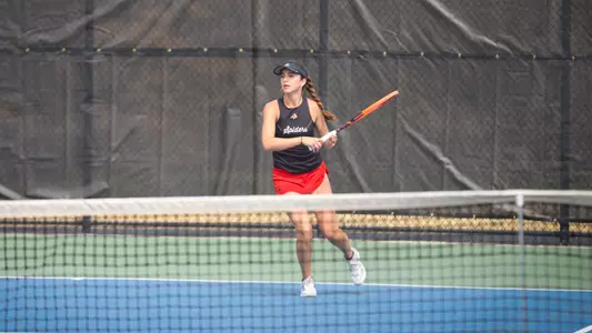 Campodonico hitting a ball back