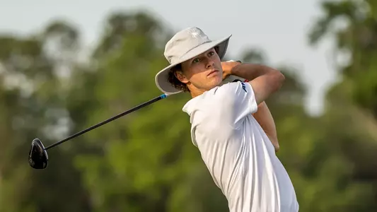 Drew Carlin stares at his shot from the tee box