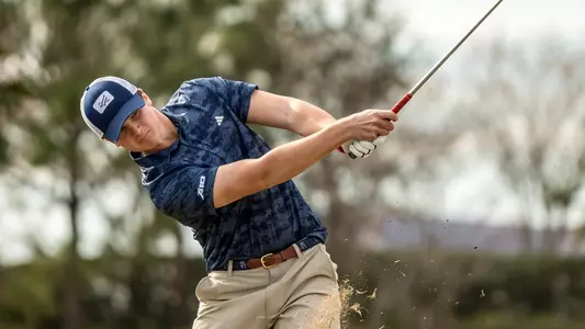 Tommy Sharps follows through on an iron shot