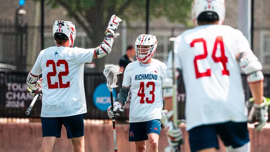 Lucas Slate and Leo Caine celebrate a goal against UMass on May 1, 2025