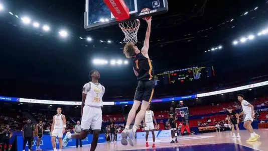 Dylan Homenick makes a reverse layup at a prep tournament