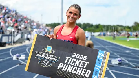 Molly Wise poses with a Ticket Punched sign after qualifying for the NCAA Championships