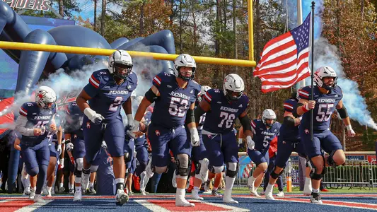 Richmond football team runs out of the tunnel