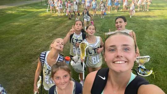 CC Jacobs selfie with lacrosse kids she's coaching Summer Series