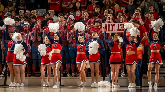 Richmond cheerleaders and fans in the crowd on the baseline