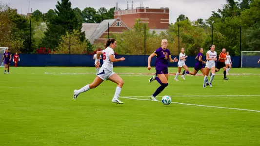 Bussiere dribbling the ball past an ECU player