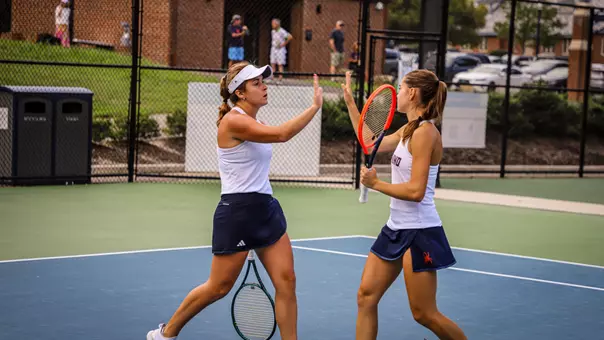 Elizabeth Novak and Sofia Barbulescu high fiving