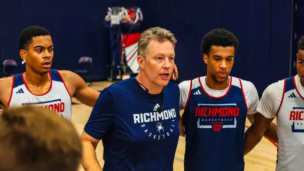 Chris Mooney addresses the team during a pre-practice huddle