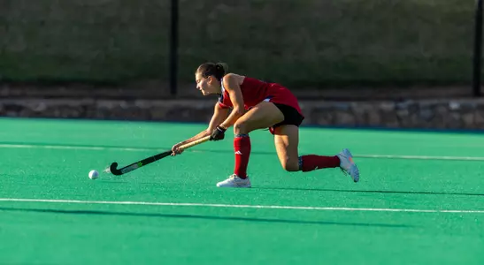 Spider field hockey defender Lillian Buckwalter passes the ball