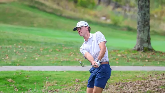 Drew Carlin chips back into the fairway