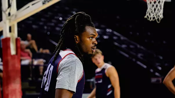 David Thomas stares on the practice court in Robins Center
