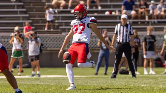 Ned Gray punts the ball away